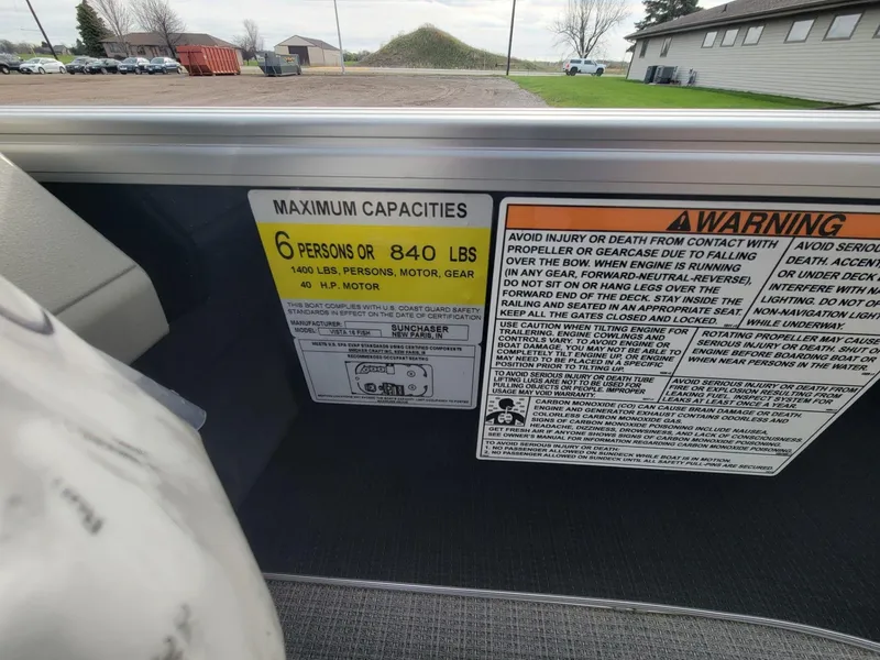 Slide: The Image of 2023 SunChaser Vista 16 Fish boat capacity and safety warning labels. - 20