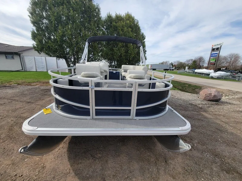 Slide: The Image of 2023 SunChaser Vista 16 Fish pontoon boat on display outdoors. - 3