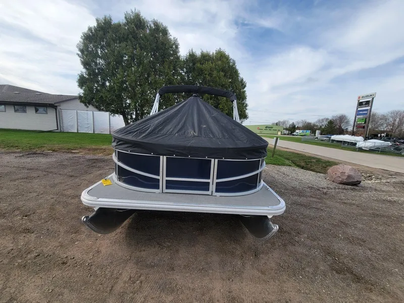 Slide: The Image of 2023 SunChaser Vista 16 Fish pontoon boat with cover, parked outdoors. - 7