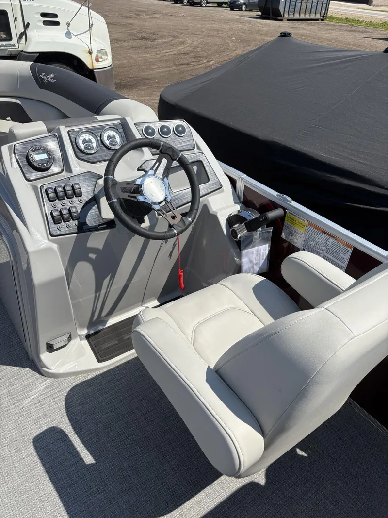 Slide: The Image of 2023 SunChaser Geneva Cruise 22 LR DH boat cockpit with steering wheel and controls. - 10