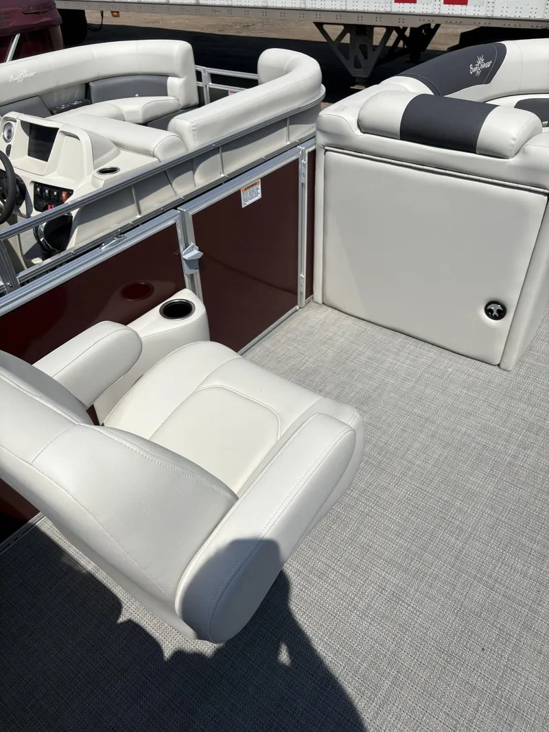 Slide: The Image of 2023 SunChaser Geneva Cruise 22 LR DH boat interior with white seating and gray flooring. - 11