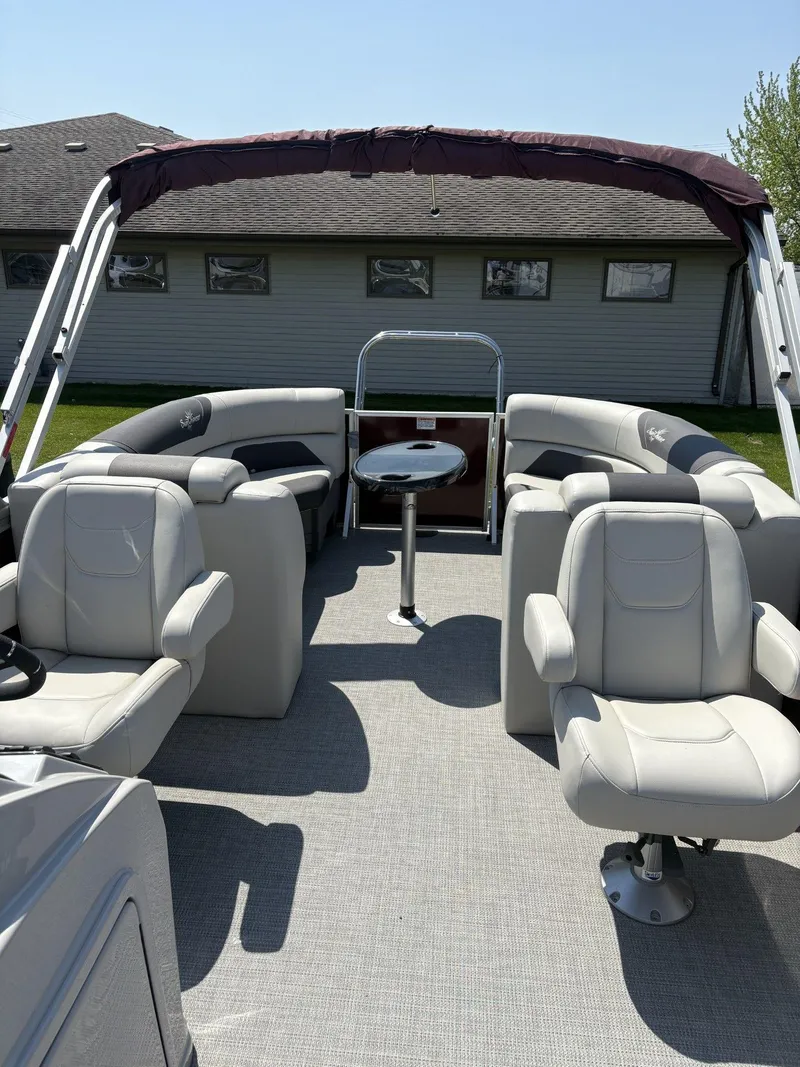Slide: The Image of 2023 SunChaser Geneva Cruise 22 LR DH pontoon boat with spacious seating and table. - 9