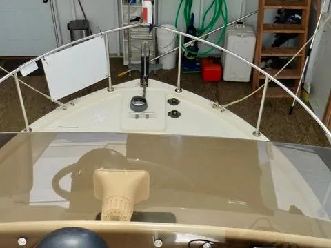 Slide: The Image of 2001 Camano Trawler boat deck with steering wheel and navigation equipment. - 11