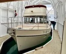 Slide: The Image of 2001 Camano Trawler docked in a covered boathouse. - 2