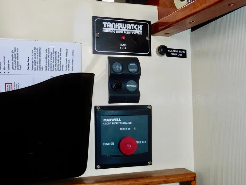 Slide: The Image of Control panel of a 2001 Camano Trawler featuring TankWatch and Maxwell systems. - 29