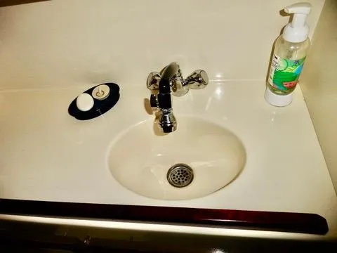 Slide: The Image of Sink area on a 2001 Camano Trawler with soap and faucet. - 35