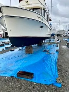 Slide: The Image of 2001 Camano Trawler on blue tarp in boatyard, ready for maintenance. - 41
