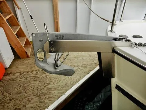 Slide: The Image of Anchor on 2001 Camano Trawler, secured on deck, in a wooden dock setting. - 46