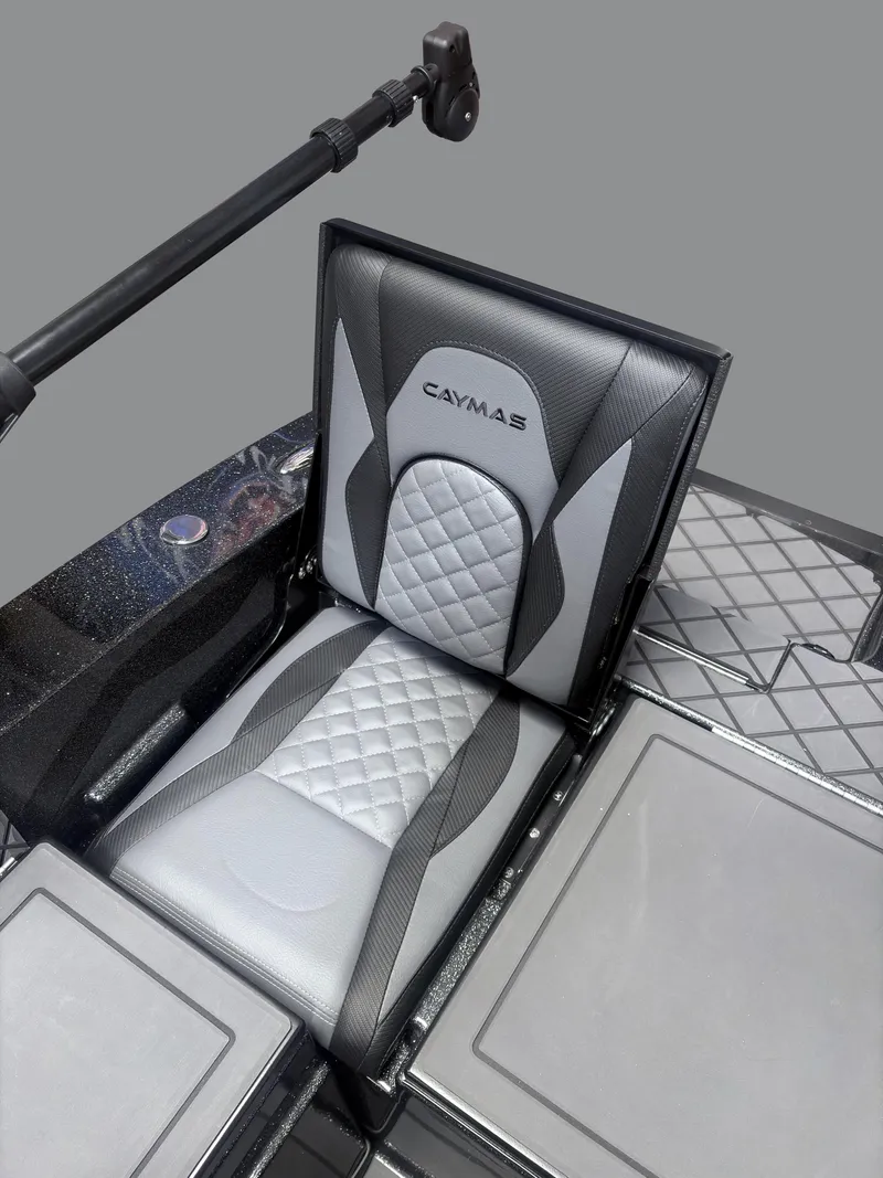 Slide: The Image of 2025 Caymas DV 22 boat seat with quilted design and sleek black and gray finish. - 16