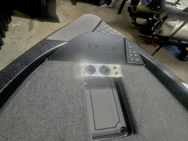 Slide: The Image of 2025 Caymas DV 22 boat dashboard with control panel and textured surface. - 2