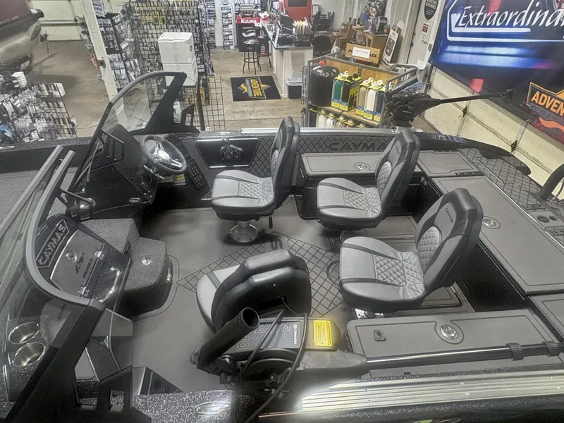 Slide: The Image of 2025 Caymas DV 22 boat interior with four seats and modern dashboard. - 3