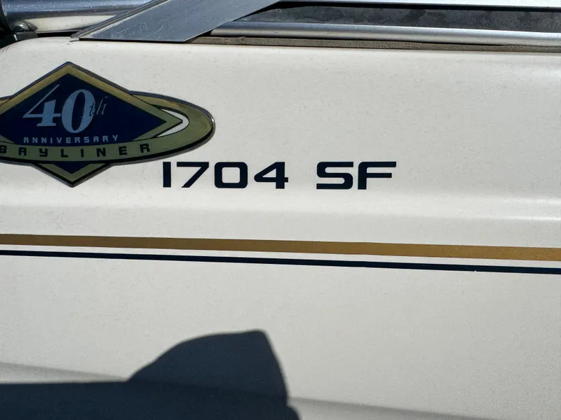 Slide: The Image of Bayliner 1704 SF 1996 boat with 40th anniversary emblem. - 3