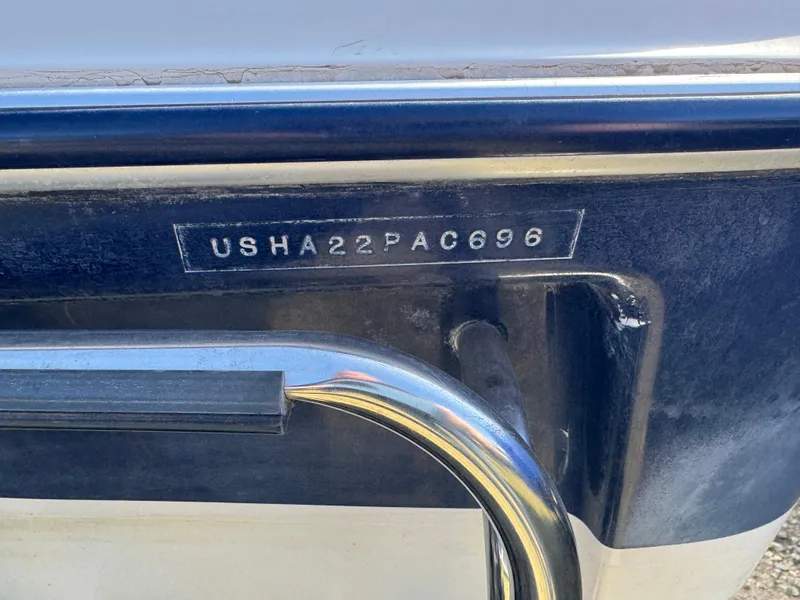 Slide: The Image of 1996 Bayliner 1704 SF boat with visible hull identification number. - 6