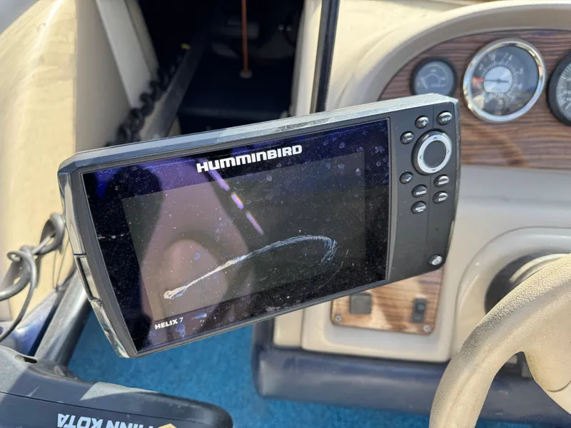 Slide: The Image of Humminbird Helix 7 fish finder on 1996 Bayliner 1704 SF dashboard. - 8