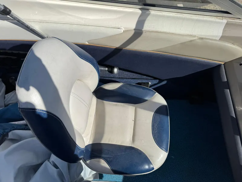 Slide: The Image of Bayliner 1704 SF 1996 boat interior with blue and white seat. - 9