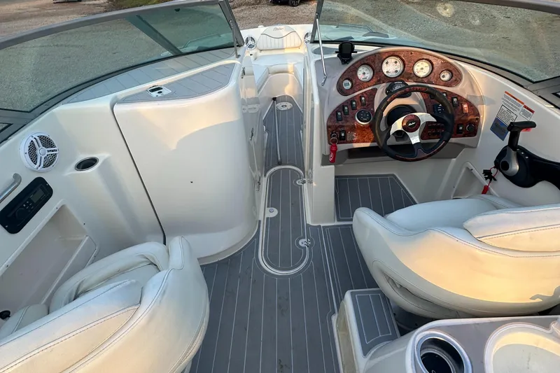 Slide: The Image of 2006 Rinker 262 Captiva Bowrider interior with steering wheel and seating. - 22