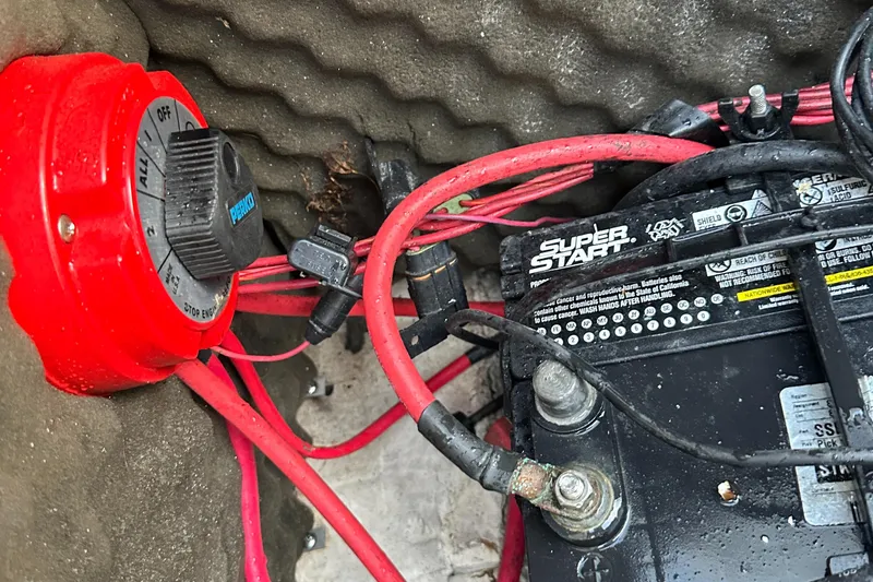 Slide: The Image of Battery and wiring setup in a 2006 Rinker 262 Captiva Bowrider boat. - 26