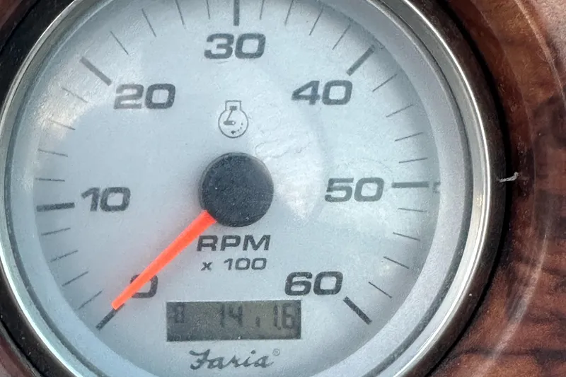 Slide: The Image of Tachometer of 2006 Rinker 262 Captiva Bowrider showing RPM and engine hours. - 28