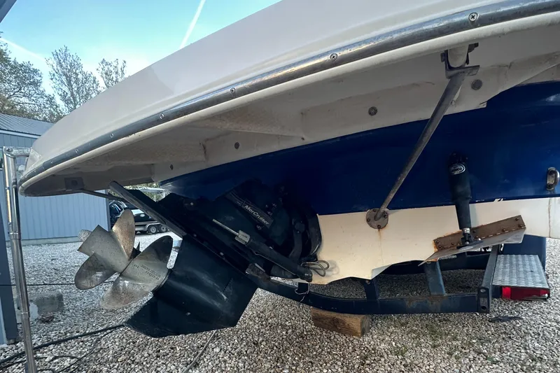 Slide: The Image of 2006 Rinker 262 Captiva Bowrider boat stern with propeller and outdrive visible. - 29