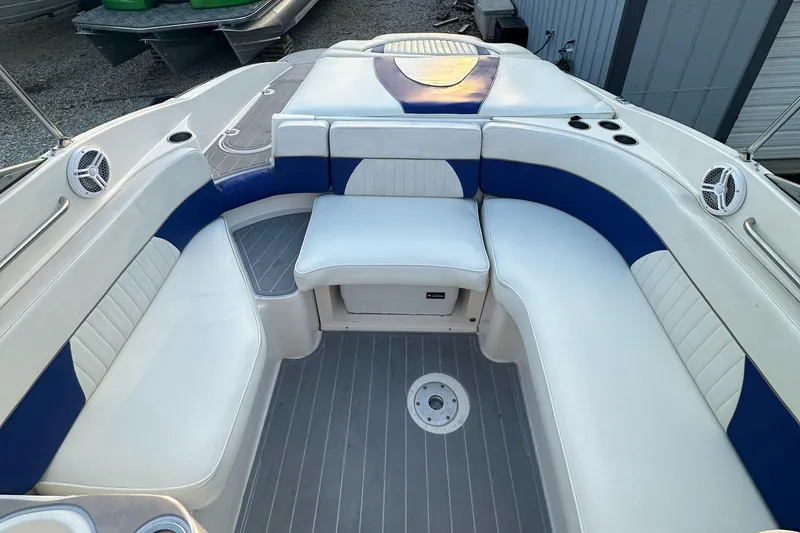 Slide: The Image of 2006 Rinker 262 Captiva Bowrider interior with white and blue seating. - 9