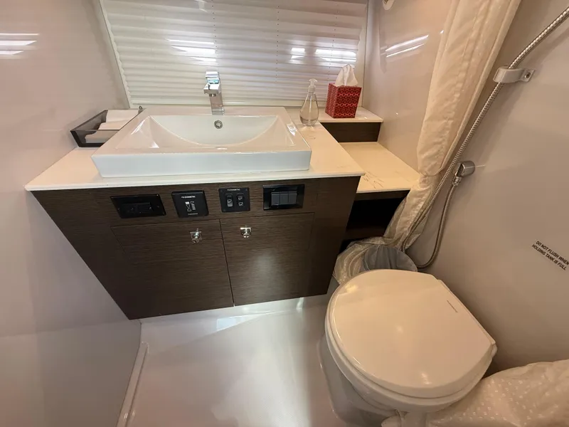 Slide: The Image of 2020 Cruisers Yachts 38 GLS OB bathroom with modern sink and toilet. - 22