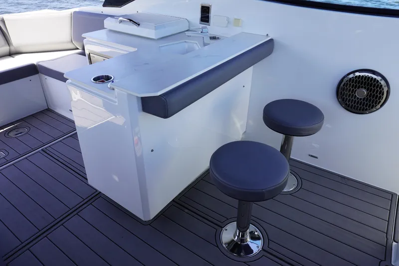 Slide: The Image of Cruisers Yachts 38 GLS OB 2020 boat interior with seating and table. - 10
