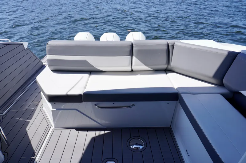 Slide: The Image of 2020 Cruisers Yachts 38 GLS OB with gray seating, overlooking the ocean. - 11