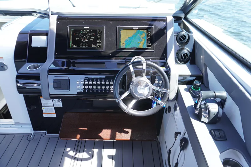 Slide: The Image of Helm of 2020 Cruisers Yachts 38 GLS OB with dual displays and controls. - 14
