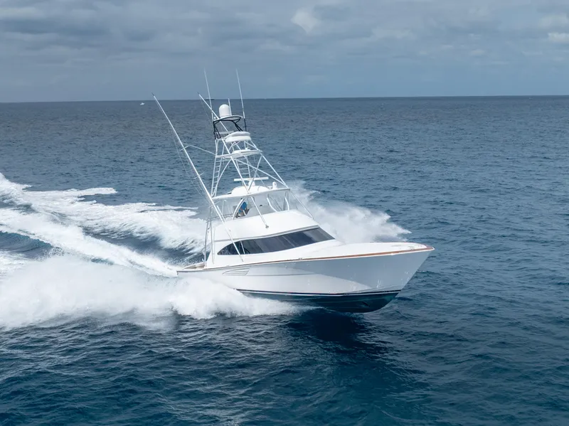 The Image of 2025 Viking 58 Convertible yacht cruising on open ocean waters. - 0