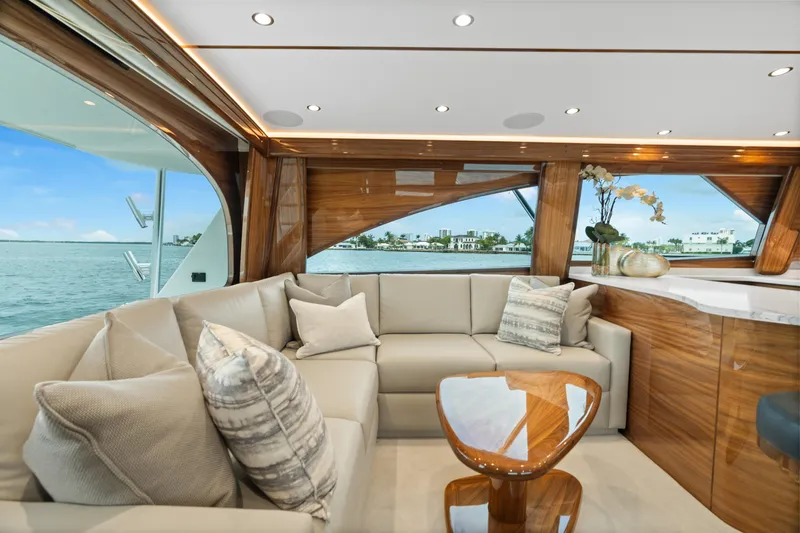 Slide: The Image of Luxurious interior of 2025 Viking 58 Convertible yacht with elegant seating and ocean view. - 16