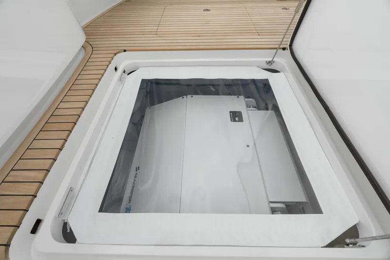 Slide: The Image of Hatch on 2025 Viking 58 Convertible yacht, showcasing engine compartment. - 20