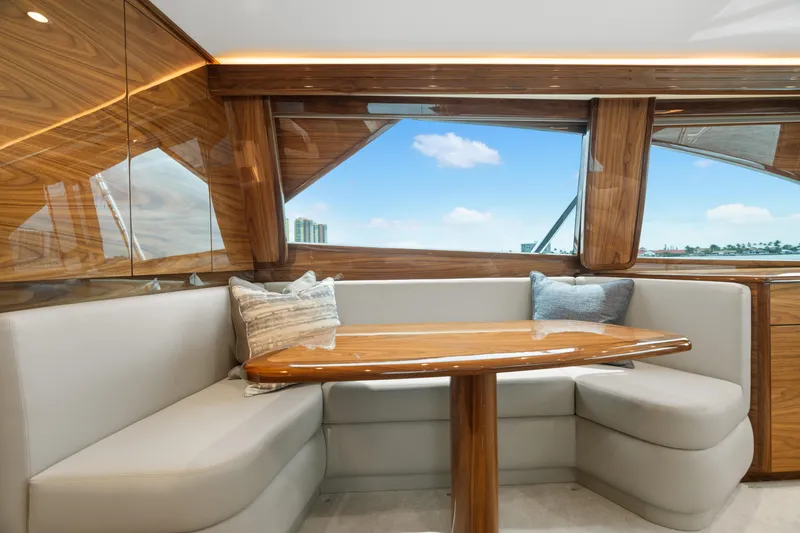Slide: The Image of Luxurious interior of 2025 Viking 58 Convertible yacht with elegant seating and wooden accents. - 22
