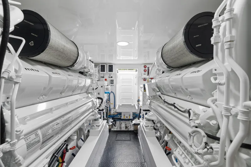 Slide: The Image of Engine room of 2025 Viking 58 Convertible yacht, featuring advanced machinery and clean design. - 33