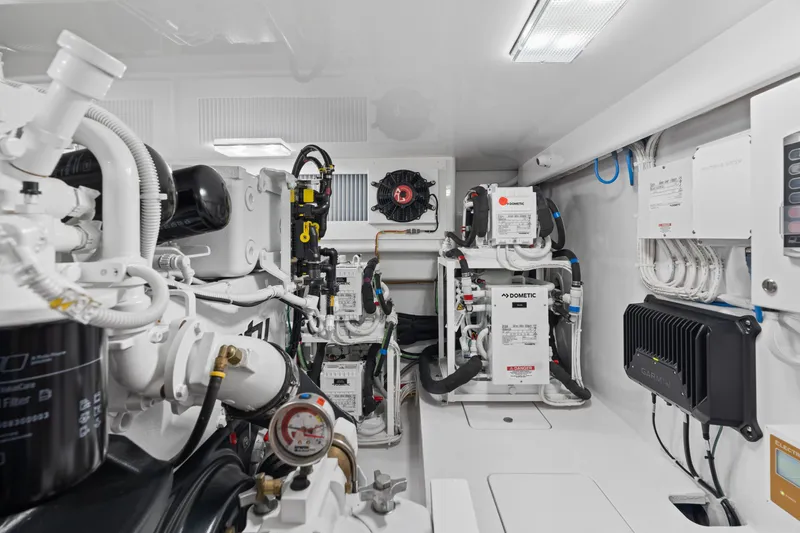 Slide: The Image of Engine room of 2025 Viking 58 Convertible yacht, showcasing advanced machinery and equipment. - 36