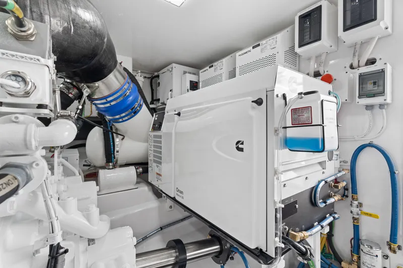 Slide: The Image of Engine room of 2025 Viking 58 Convertible yacht, featuring advanced machinery and equipment. - 39