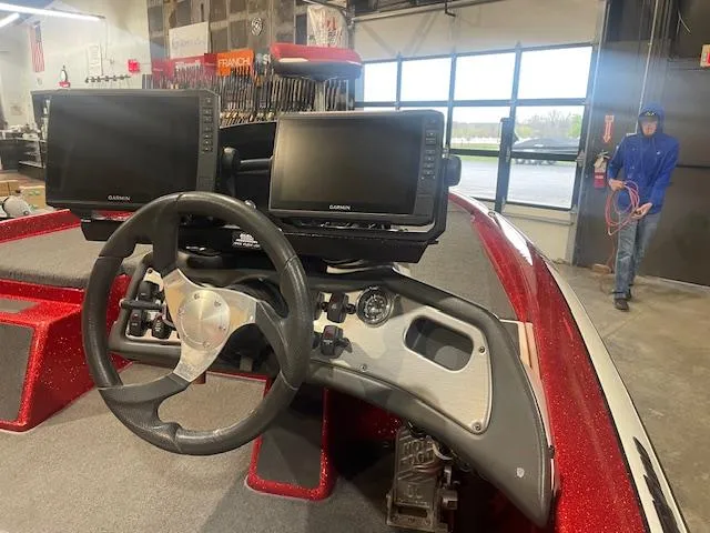 Slide: The Image of 2019 Skeeter ZX190 boat dashboard with dual Garmin displays in a showroom. - 5