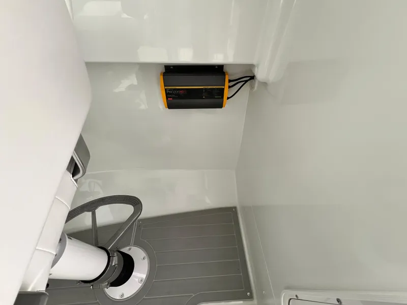 Slide: The Image of Interior of a 2025 Parker 2420 boat, featuring a mounted electronic device. - 4