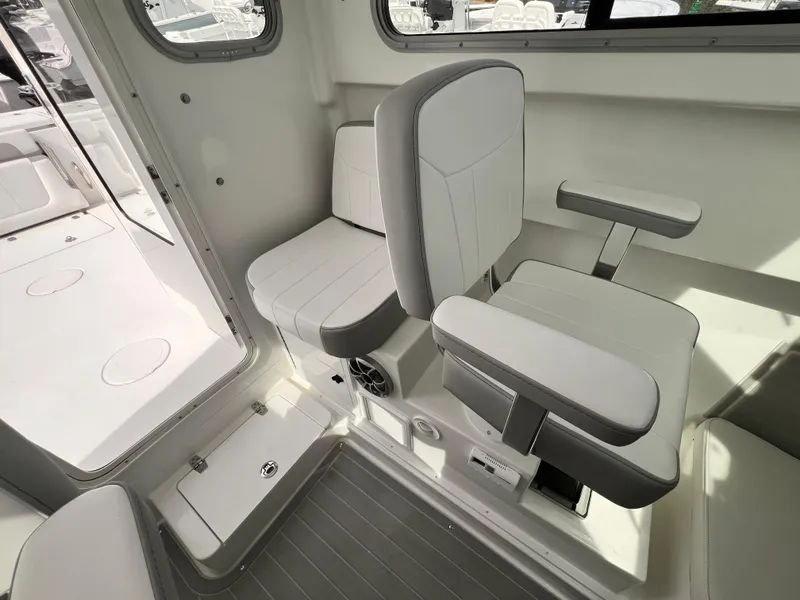 Slide: The Image of Interior of 2025 Parker 2420 boat, featuring modern seating and sleek design. - 7