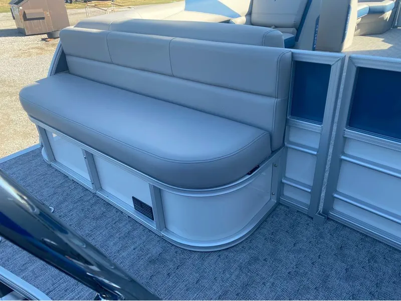 Slide: The Image of 2024 Trifecta 22CL2 LE pontoon boat with gray seating and carpeted flooring. - 27