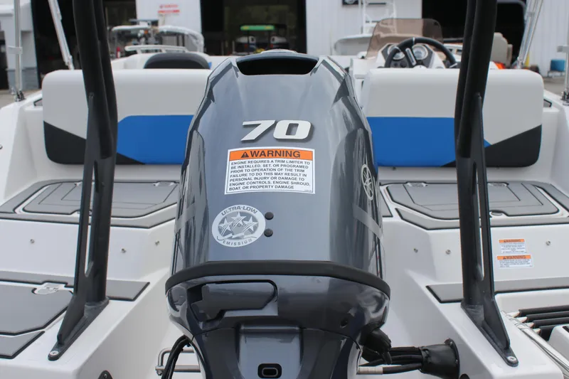Slide: The Image of 2025 Starcraft SV 16 OB boat with a 70 HP outboard motor, rear view. - 12