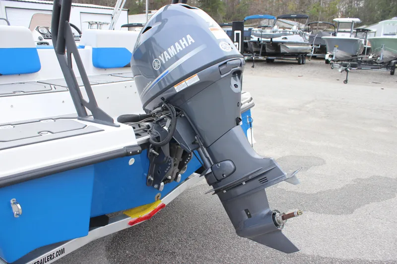 Slide: The Image of 2025 Starcraft SV 16 OB boat with Yamaha outboard motor in a marina setting. - 13