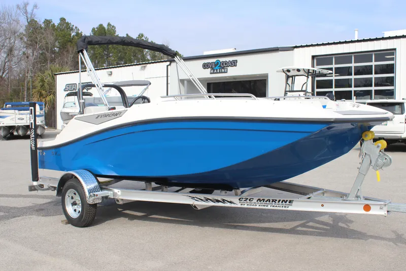 Slide: The Image of 2025 Starcraft SV 16 OB boat on trailer at dealership. - 2