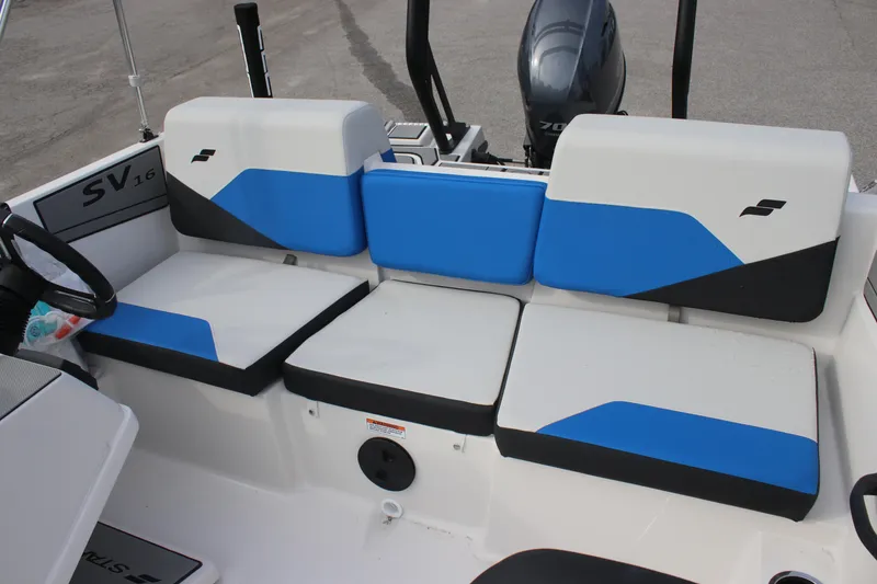 Slide: The Image of 2025 Starcraft SV 16 OB boat interior with blue and white seating. - 8