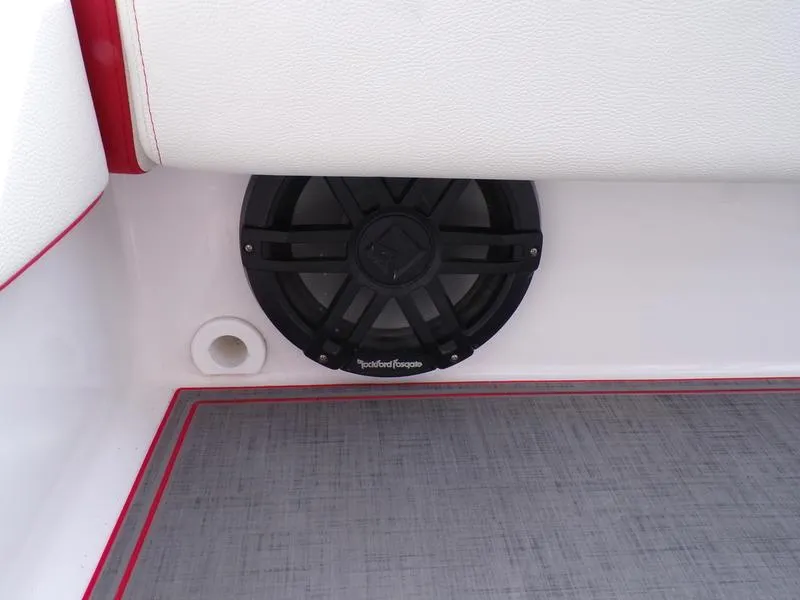 Slide: The Image of Speaker installed in a 2026 Statement 250 CC boat, featuring red and white interior accents. - 10