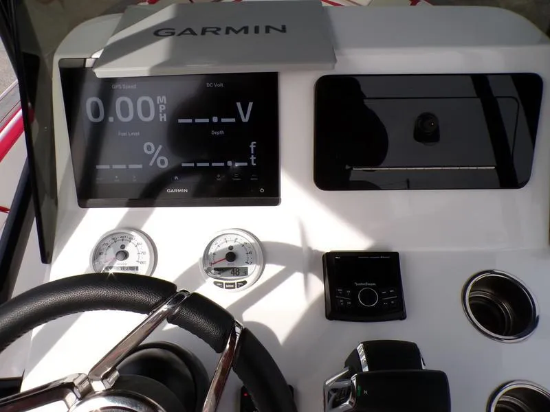 Slide: The Image of Steering console of 2026 Statement 250 CC boat with Garmin display and controls. - 17