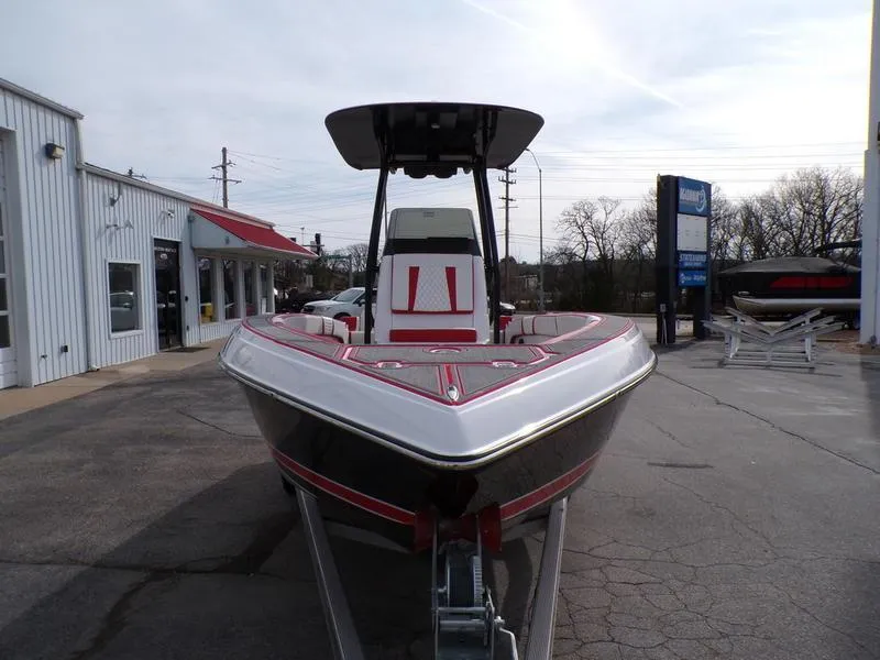 Slide: The Image of 2026 Statement 250 CC boat, sleek design, parked outdoors at a dealership. - 3