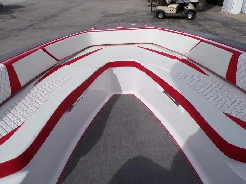 Slide: The Image of Bow seating area of 2026 Statement 250 CC boat with red and white upholstery. - 6