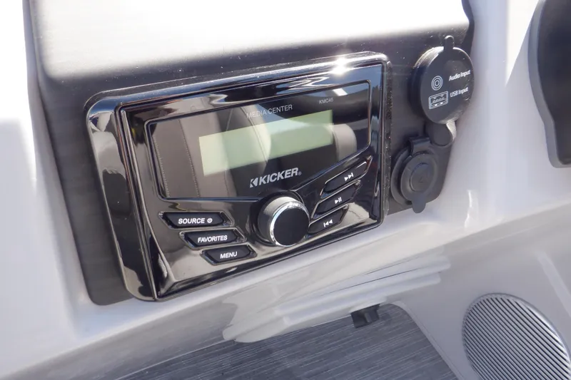 Slide: The Image of Kicker audio system on 2022 Bennington SX 22 Swingback boat dashboard. - 11