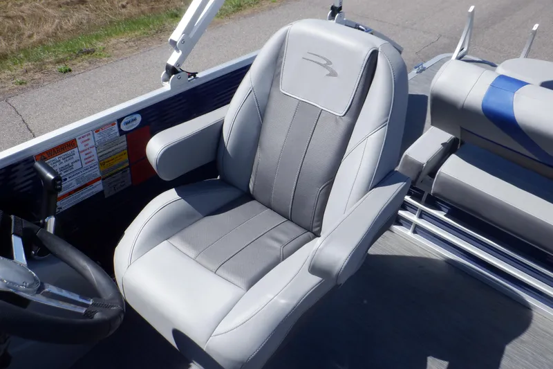 Slide: The Image of 2022 Bennington SX 22 Swingback boat seat with gray upholstery and armrests. - 13