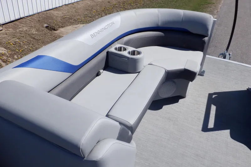 Slide: The Image of 2022 Bennington SX 22 Swingback boat interior with gray seating and cup holders. - 16